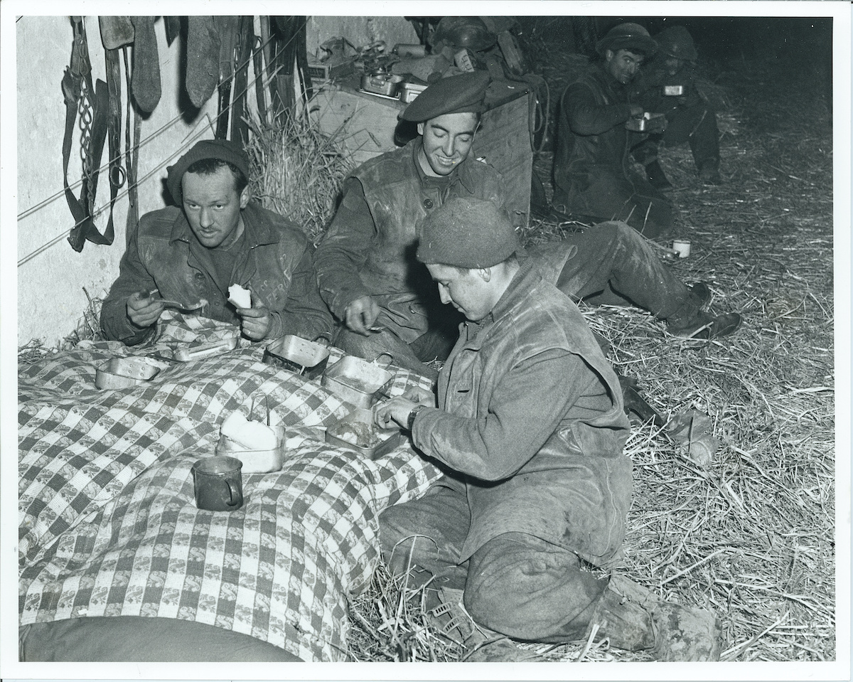 Argylls eat in barn near Veen, 7 March 1945